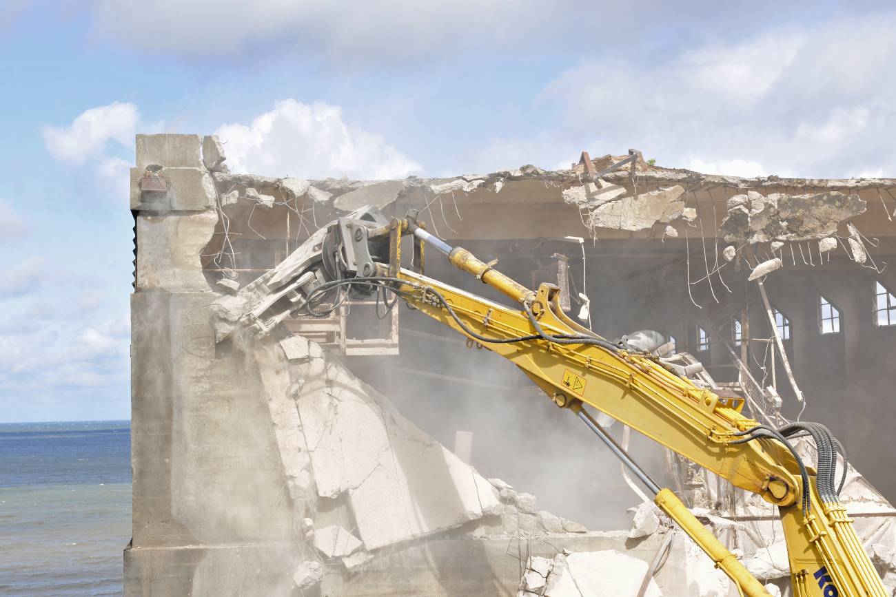 Demolition construction work using an excavator